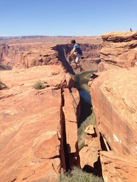 VK jumping over a cliff at Horseshoe Bend, Arizona, USA