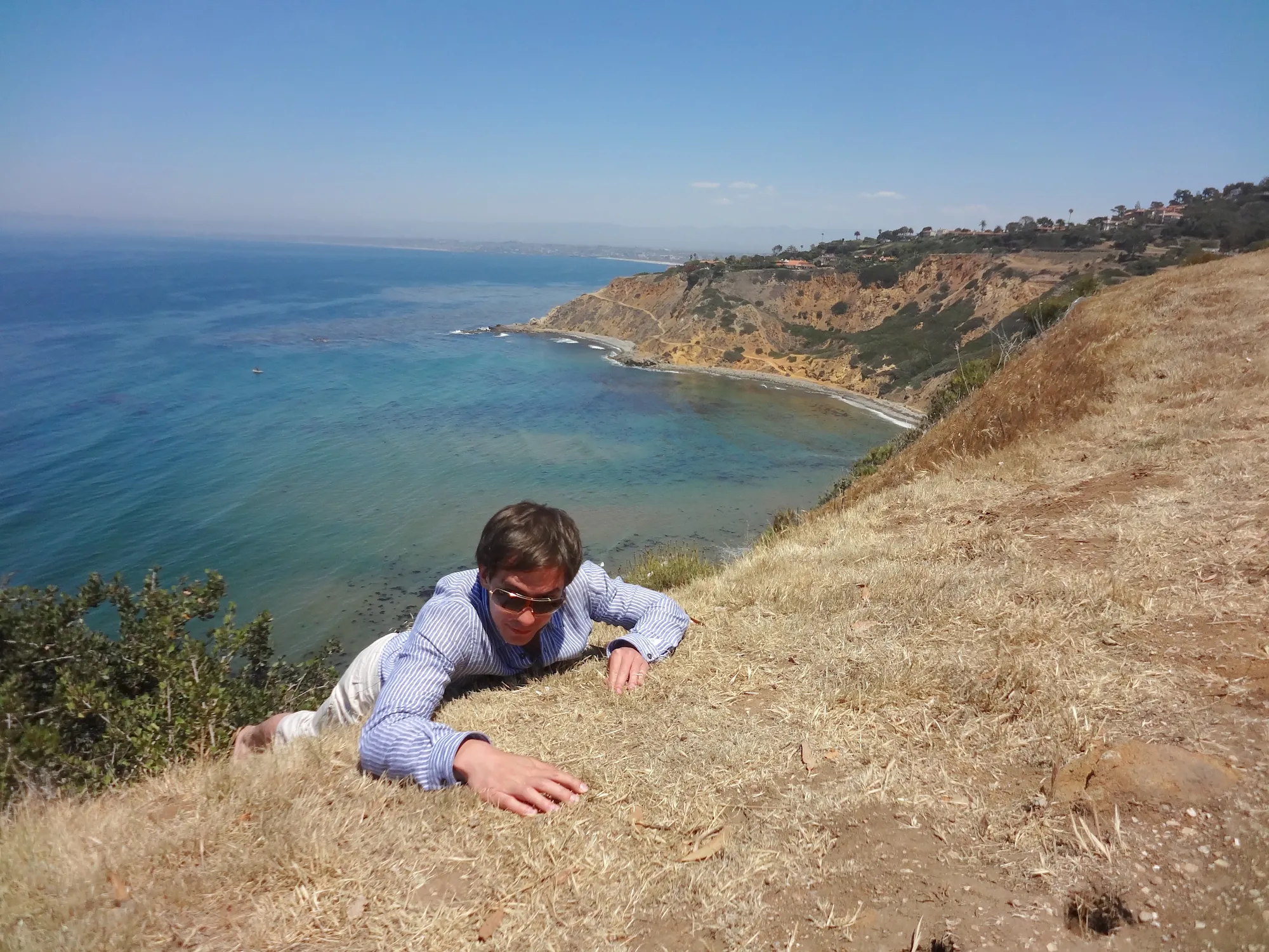 VK hanging off cliff Big Sur